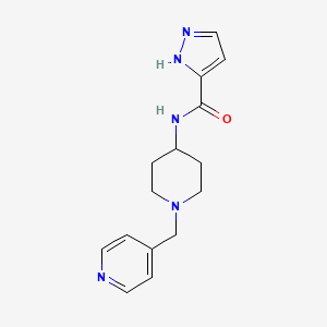 molecular formula C15H19N5O B7323674 N-[1-(pyridin-4-ylmethyl)piperidin-4-yl]-1H-pyrazole-5-carboxamide 