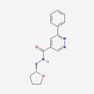 molecular formula C16H17N3O2 B7336975 N-[[(2R)-oxolan-2-yl]methyl]-6-phenylpyridazine-4-carboxamide 