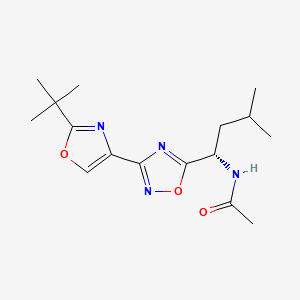 molecular formula C16H24N4O3 B7344428 N-[(1S)-1-[3-(2-tert-butyl-1,3-oxazol-4-yl)-1,2,4-oxadiazol-5-yl]-3-methylbutyl]acetamide 