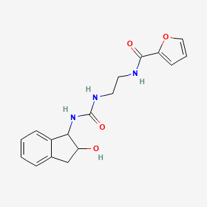 molecular formula C17H19N3O4 B7366049 N-[2-[(2-hydroxy-2,3-dihydro-1H-inden-1-yl)carbamoylamino]ethyl]furan-2-carboxamide 
