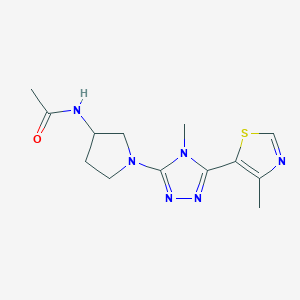 molecular formula C13H18N6OS B7381100 N-[1-[4-methyl-5-(4-methyl-1,3-thiazol-5-yl)-1,2,4-triazol-3-yl]pyrrolidin-3-yl]acetamide 