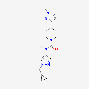 molecular formula C18H26N6O B7392546 N-[1-(1-cyclopropylethyl)pyrazol-4-yl]-4-(1-methylpyrazol-3-yl)piperidine-1-carboxamide 