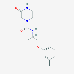 molecular formula C15H21N3O3 B7411516 N-[1-(3-methylphenoxy)propan-2-yl]-3-oxopiperazine-1-carboxamide 