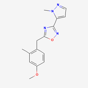 molecular formula C15H16N4O2 B7449912 5-[(4-Methoxy-2-methylphenyl)methyl]-3-(2-methylpyrazol-3-yl)-1,2,4-oxadiazole 