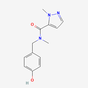 molecular formula C13H15N3O2 B7559586 N-[(4-hydroxyphenyl)methyl]-N,2-dimethylpyrazole-3-carboxamide 