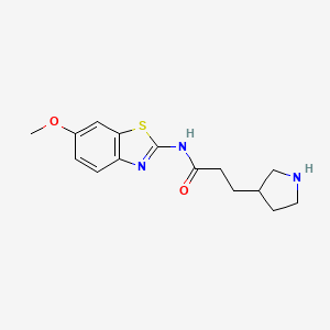 molecular formula C15H19N3O2S B7621160 N-(6-methoxy-1,3-benzothiazol-2-yl)-3-pyrrolidin-3-ylpropanamide 