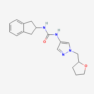 molecular formula C18H22N4O2 B7655905 1-(2,3-dihydro-1H-inden-2-yl)-3-[1-(oxolan-2-ylmethyl)pyrazol-4-yl]urea 