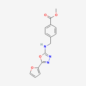 molecular formula C15H13N3O4 B7657474 Methyl 4-[[[5-(furan-2-yl)-1,3,4-oxadiazol-2-yl]amino]methyl]benzoate 
