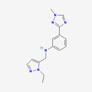molecular formula C15H18N6 B7677379 N-[(2-ethylpyrazol-3-yl)methyl]-3-(1-methyl-1,2,4-triazol-3-yl)aniline 