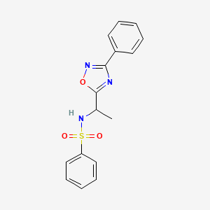 molecular formula C16H15N3O3S B7713897 N-[1-(3-phenyl-1,2,4-oxadiazol-5-yl)ethyl]benzenesulfonamide 
