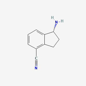 molecular formula C10H10N2 B7856274 (R)-1-amino-2,3-dihydro-1H-indene-4-carbonitrile 