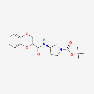 molecular formula C18H24N2O5 B7912457 (R)-3-[(2,3-Dihydro-benzo[1,4]dioxine-2-carbonyl)-amino]-pyrrolidine-1-carboxylic acid tert-butyl ester 