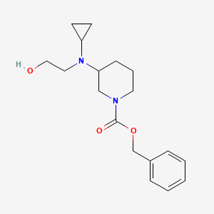 molecular formula C18H26N2O3 B7922052 3-[Cyclopropyl-(2-hydroxy-ethyl)-amino]-piperidine-1-carboxylic acid benzyl ester 