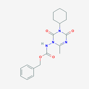 molecular formula C18H22N4O4 B8040209 benzyl N-(3-cyclohexyl-6-methyl-2,4-dioxo-1,3,5-triazin-1-yl)carbamate 