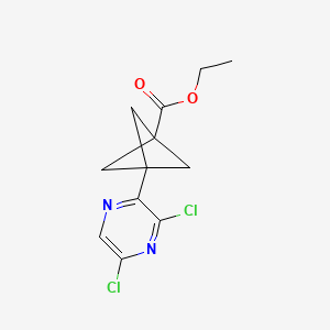 molecular formula C12H12Cl2N2O2 B8053435 Ethyl 3-(3,5-dichloropyrazin-2-yl)bicyclo[1.1.1]pentane-1-carboxylate 