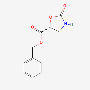 molecular formula C11H11NO4 B8071824 (R)-benzyl 2-oxooxazolidine-5-carboxylate 