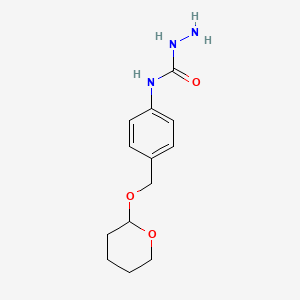 molecular formula C13H19N3O3 B8079869 N-(4-(((Tetrahydro-2H-pyran-2-yl)oxy)methyl)phenyl)hydrazinecarboxamide 