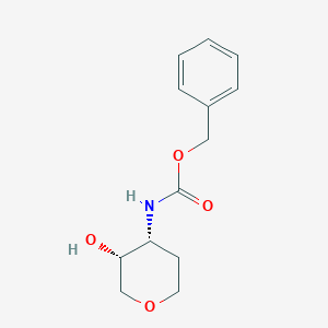 molecular formula C13H17NO4 B8186779 Benzyl ((3R,4R)-3-hydroxytetrahydro-2H-pyran-4-yl)carbamate 