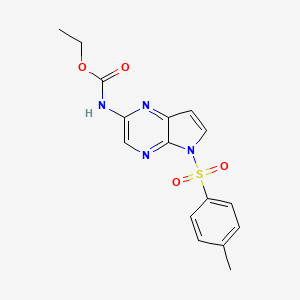 molecular formula C16H16N4O4S B8230380 ethyl (5-tosyl-5H-pyrrolo[2,3-b]pyrazin-2-yl)carbamate CAS No. 1869118-24-0