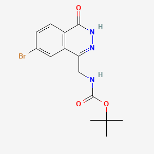 molecular formula C14H16BrN3O3 B8239123 Tert-butyl ((7-bromo-4-oxo-3,4-dihydrophthalazin-1-YL)methyl)carbamate 
