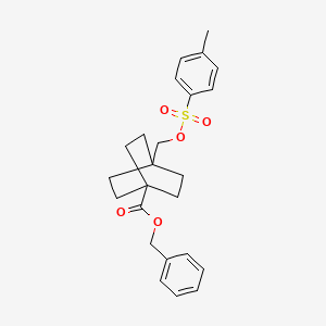 molecular formula C24H28O5S B8259926 Benzyl 4-((tosyloxy)methyl)bicyclo[2.2.2]octane-1-carboxylate 