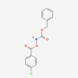 molecular formula C15H12ClNO4 B8266662 Benzyl 4-chlorobenzoyloxycarbamate 