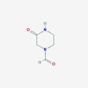 molecular formula C5H8N2O2 B8342548 1-Formyl-3-oxopiperazine 