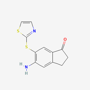 5-Amino-6-(2-thiazolylthio)-1-indanone