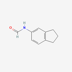 molecular formula C10H11NO B8499654 N-Formyl-5-aminoindane 