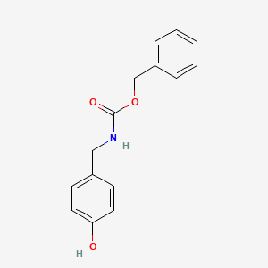 molecular formula C15H15NO3 B8524043 benzyl N-[(4-hydroxyphenyl)methyl]carbamate 