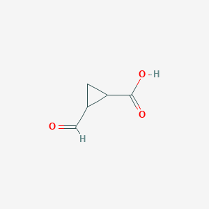 molecular formula C5H6O3 B008558 1-Formylcyclopropane-2-carboxylic acid CAS No. 103425-17-8