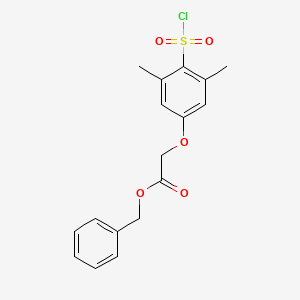 molecular formula C17H17ClO5S B8562042 Benzyl 2-(4-(chlorosulfonyl)-3,5-dimethylphenoxy)acetate 
