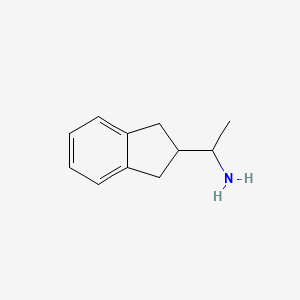 B8572370 2-(1-Aminoethyl)indane CAS No. 1401619-24-6