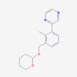 2-(2-Methyl-3-{[(oxan-2-yl)oxy]methyl}phenyl)pyrazine