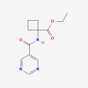 molecular formula C12H15N3O3 B8582354 Ethyl1-(pyrimidine-5-carboxamido)cyclobutanecarboxylate 