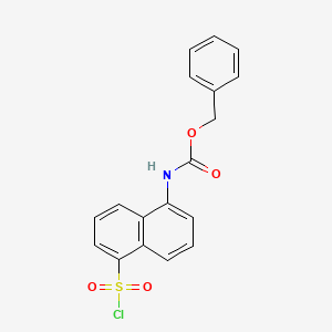 molecular formula C18H14ClNO4S B8585249 Benzyl N-(5-chlorosulfonylnaphthalen-1-yl)carbamate 