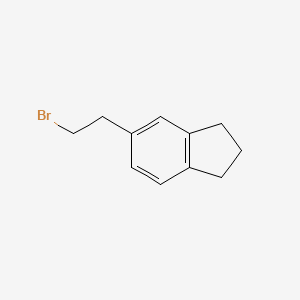 molecular formula C11H13Br B8588443 5-(2-Bromoethyl)indane 
