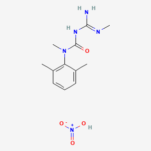 molecular formula C12H19N5O4 B8590140 Urea, N-(2,6-dimethylphenyl)-N'-(imino(methylamino)methyl)-N-methyl-, mononitrate CAS No. 65009-22-5
