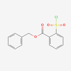 molecular formula C14H11ClO4S B8596937 Benzyl 2-(chlorosulfonyl)benzoate CAS No. 64548-31-8