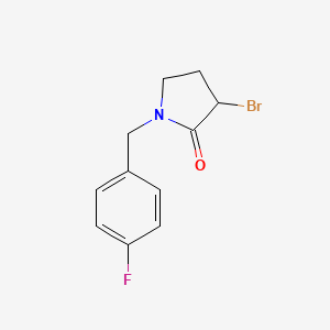 3-Bromo-1-[(4-fluorophenyl)methyl]pyrrolidin-2-one