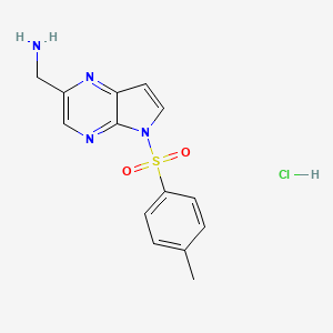 molecular formula C14H15ClN4O2S B8721312 (5-tosyl-5H-pyrrolo[2,3-b]pyrazin-2-yl)methanamine hydrochloride 
