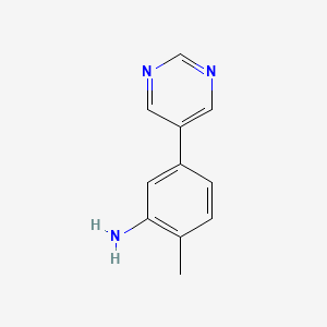 molecular formula C11H11N3 B8726806 2-Methyl-5-(pyrimidin-5-YL)aniline 