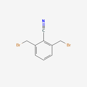 molecular formula C9H7Br2N B8730027 2,6-Bis(bromomethyl)benzonitrile 