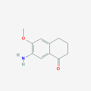 molecular formula C11H13NO2 B8776604 7-Amino-6-methoxy-1-tetralone 