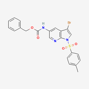 molecular formula C22H18BrN3O4S B8776920 Carbamic acid, N-[3-bromo-1-[(4-methylphenyl)sulfonyl]-1H-pyrrolo[2,3-b]pyridin-5-yl]-, phenylmethyl ester 