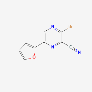 3-Bromo-6-(furan-2-yl)pyrazine-2-carbonitrile