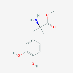 molecular formula C11H15NO4 B094928 methyl (2S)-2-amino-3-(3,4-dihydroxyphenyl)-2-methylpropanoate CAS No. 18181-08-3